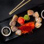 black tray filled with colourful food