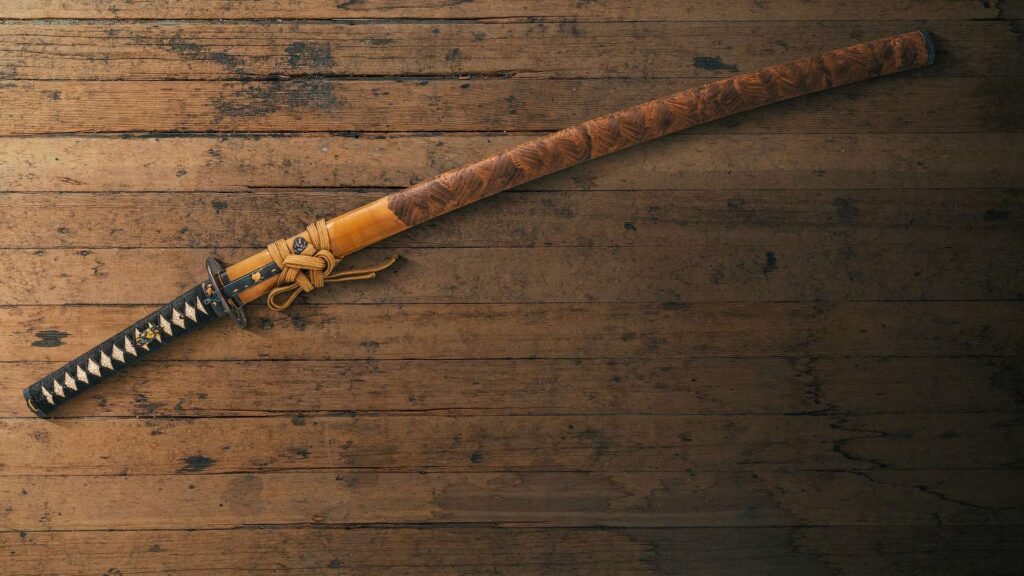 Samurai sword on wooden table