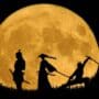 three figure silhouettes against a bright yellow moon