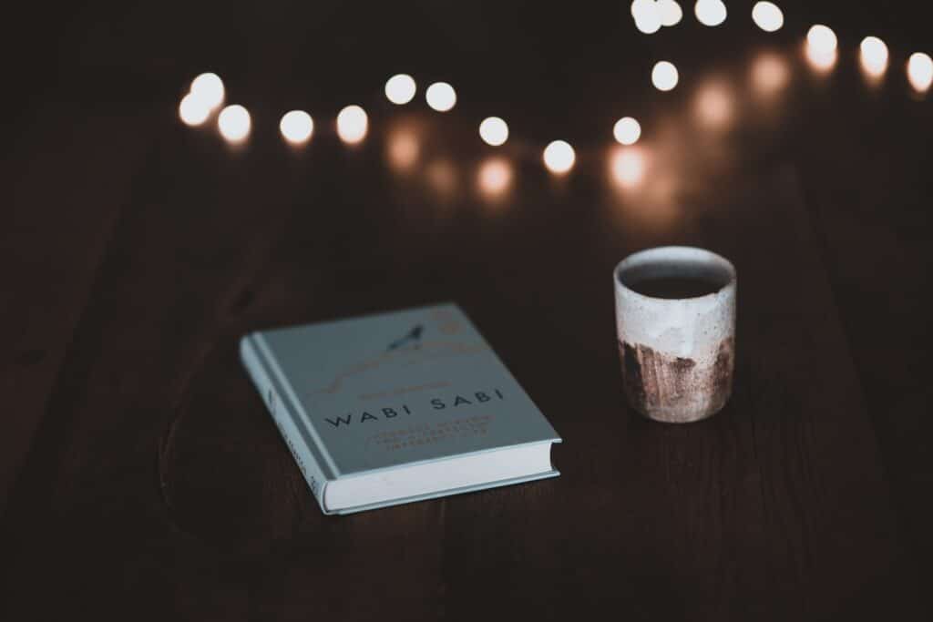 A book and cup on a table