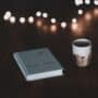 A book and cup on a table