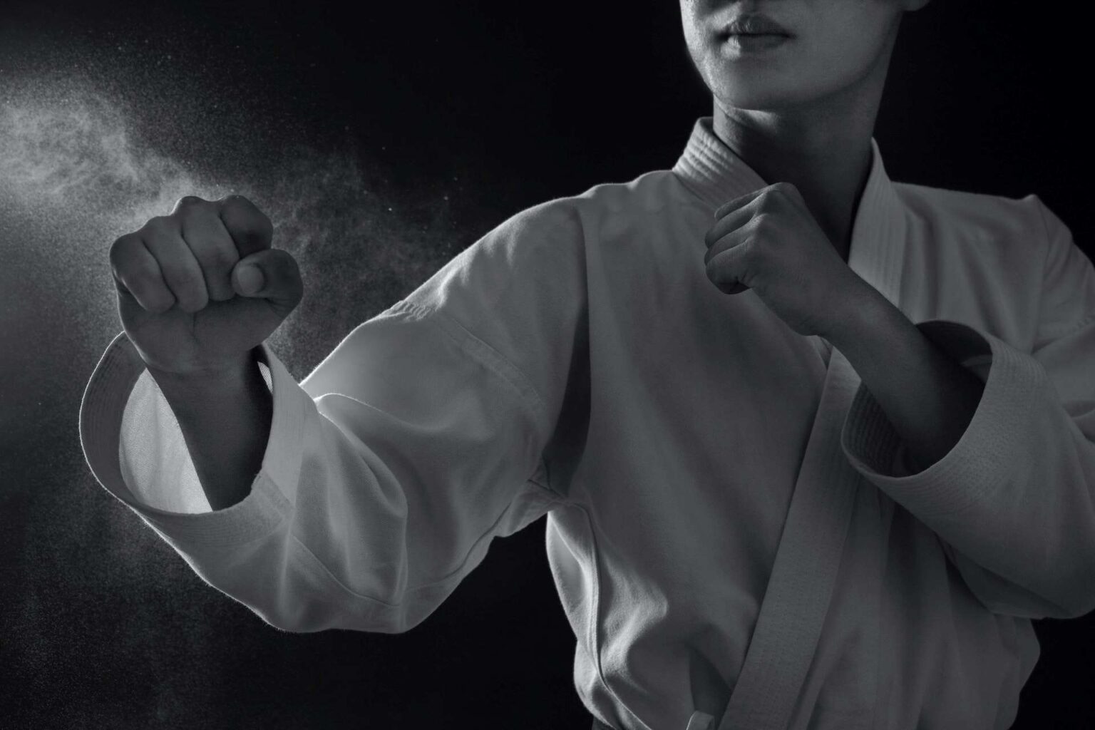 A woman in a karate pose
