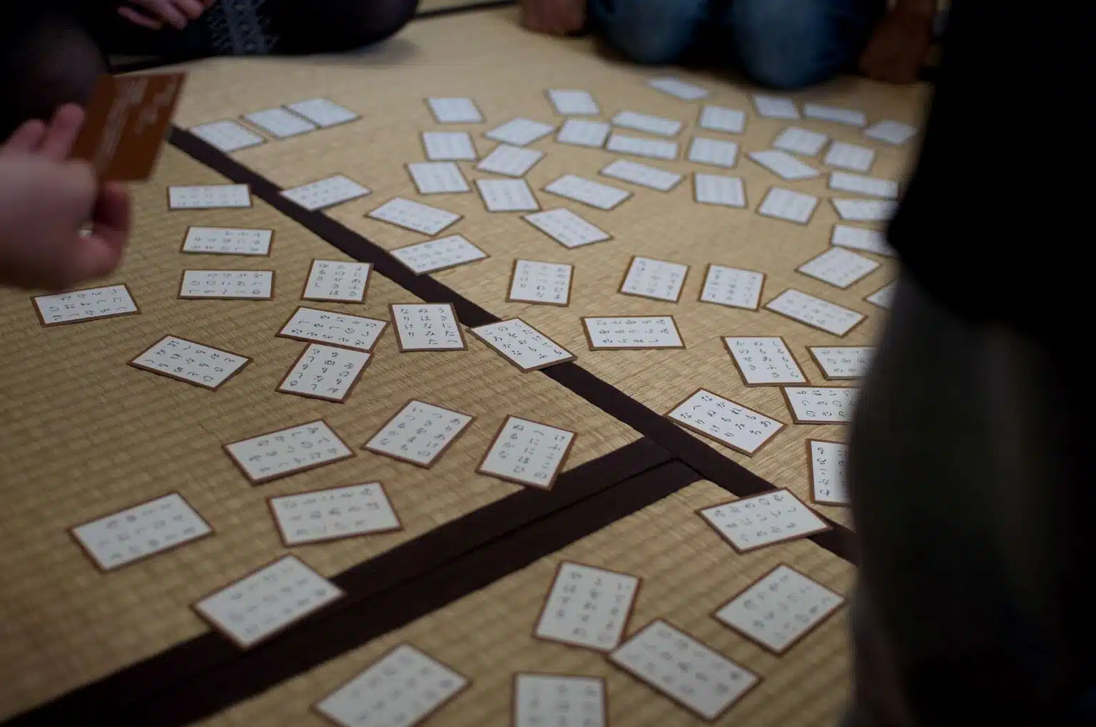 White playing cards spread across the floor