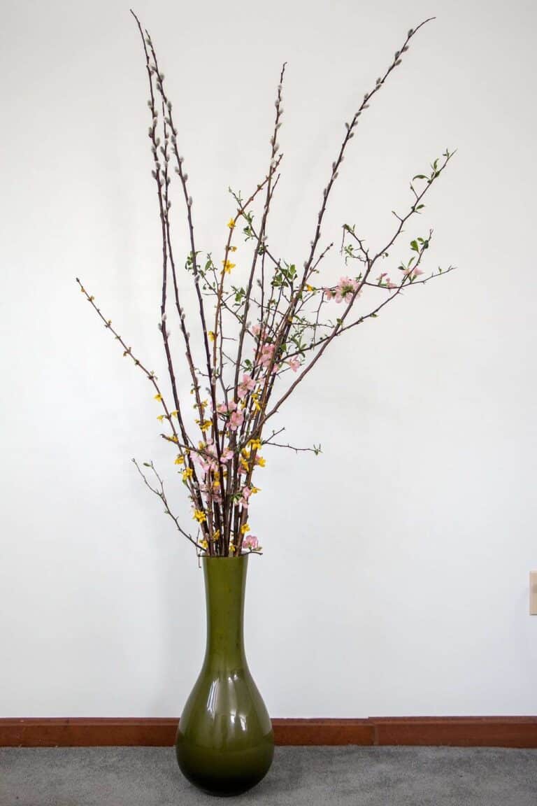 sparse foliage in a standing vase